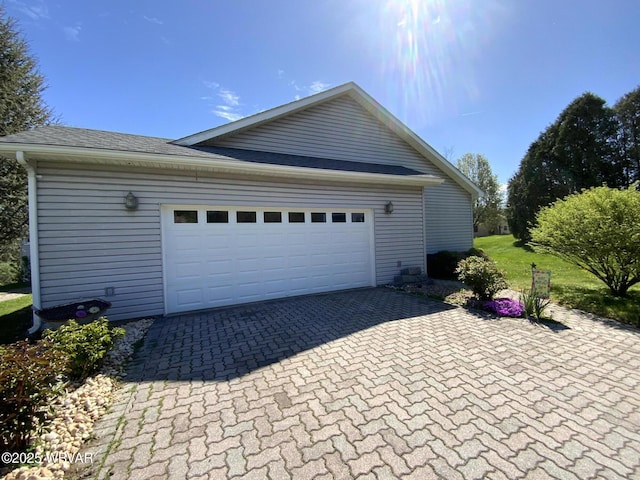 32 Chestnut Ct, Jersey Shore, PA 17740 - garage featuring decorative driveway