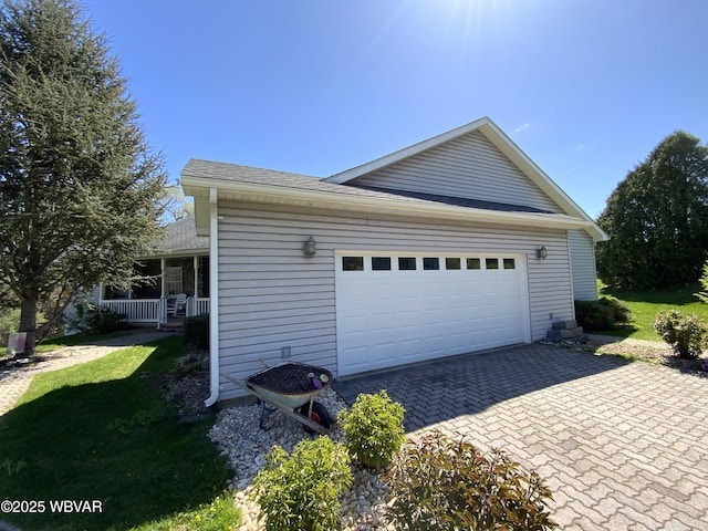 32 Chestnut Ct, Jersey Shore, PA 17740 - view of side of home featuring a lawn, roof with shingles, covered porch, and decorative driveway