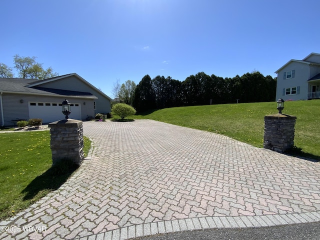 32 Chestnut Ct, Jersey Shore, PA 17740 - view of side of property with a lawn, decorative driveway, and a garage