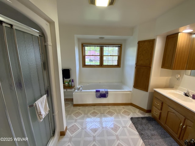 32 Chestnut Ct, Jersey Shore, PA 17740 - full bathroom with vanity, a bath, baseboards, and a stall shower