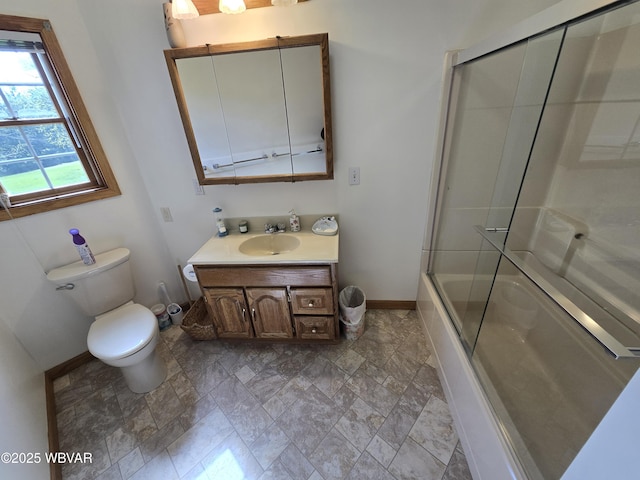 32 Chestnut Ct, Jersey Shore, PA 17740 - full bath featuring stone finish floor, baseboards, bath / shower combo with glass door, vanity, and toilet