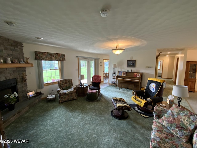 32 Chestnut Ct, Jersey Shore, PA 17740 - living room featuring a stone fireplace and carpet flooring