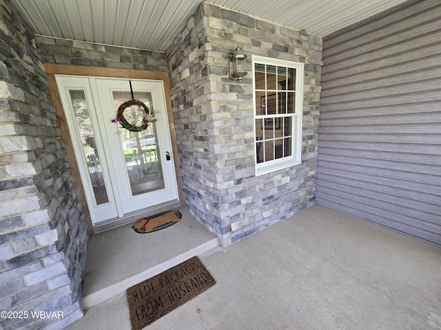 32 Chestnut Ct, Jersey Shore, PA 17740 - entrance to property featuring a porch and stone siding