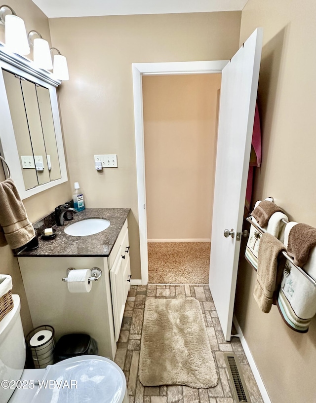 15 Hillview Ave, Williamsport, PA 17701 - bathroom with toilet, vanity, and baseboards