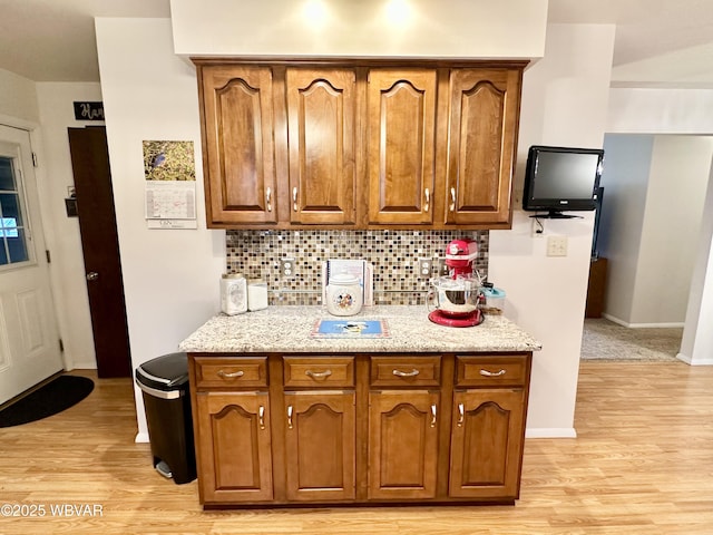 15 Hillview Ave, Williamsport, PA 17701 - kitchen with light wood finished floors, decorative backsplash, and brown cabinets