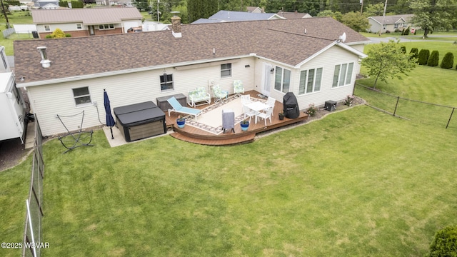 15 Hillview Ave, Williamsport, PA 17701 - back of property with a wooden deck, a shingled roof, a hot tub, and a chimney