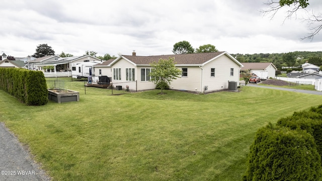 15 Hillview Ave, Williamsport, PA 17701 - view of side of home with central air condition unit, a chimney, and roof with shingles