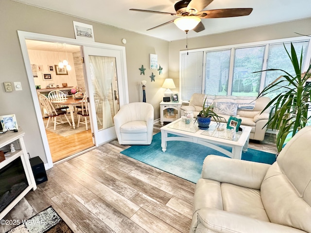 15 Hillview Ave, Williamsport, PA 17701 - living room with a ceiling fan, wood finished floors, and a chandelier