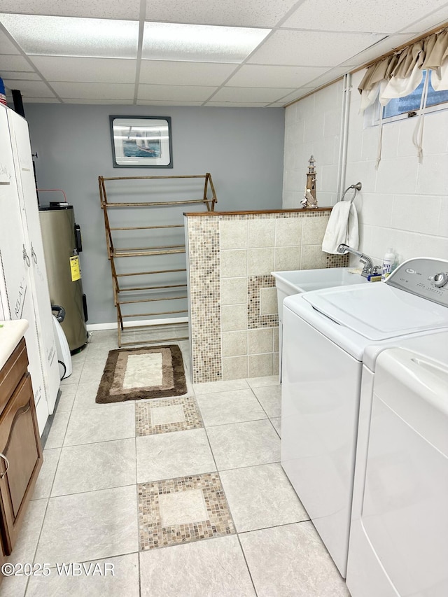 15 Hillview Ave, Williamsport, PA 17701 - laundry area featuring water heater, cabinet space, light tile patterned flooring, and separate washer and dryer