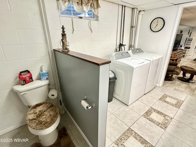 15 Hillview Ave, Williamsport, PA 17701 - washroom with washing machine and dryer, concrete block wall, and light tile patterned floors
