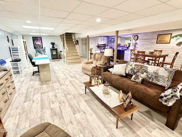 15 Hillview Ave, Williamsport, PA 17701 - living area with light wood-style floors, a paneled ceiling, stairway, and wood walls
