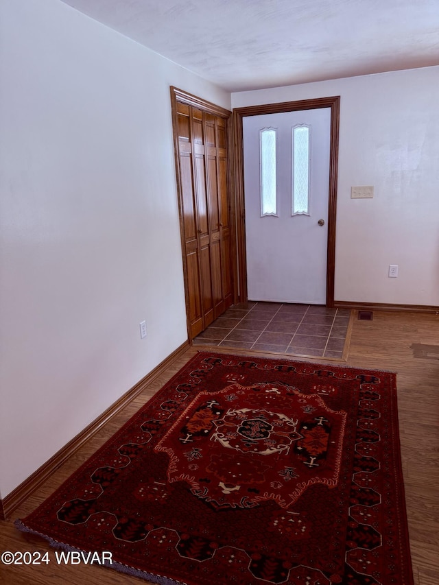 foyer entrance featuring hardwood / wood-style floors