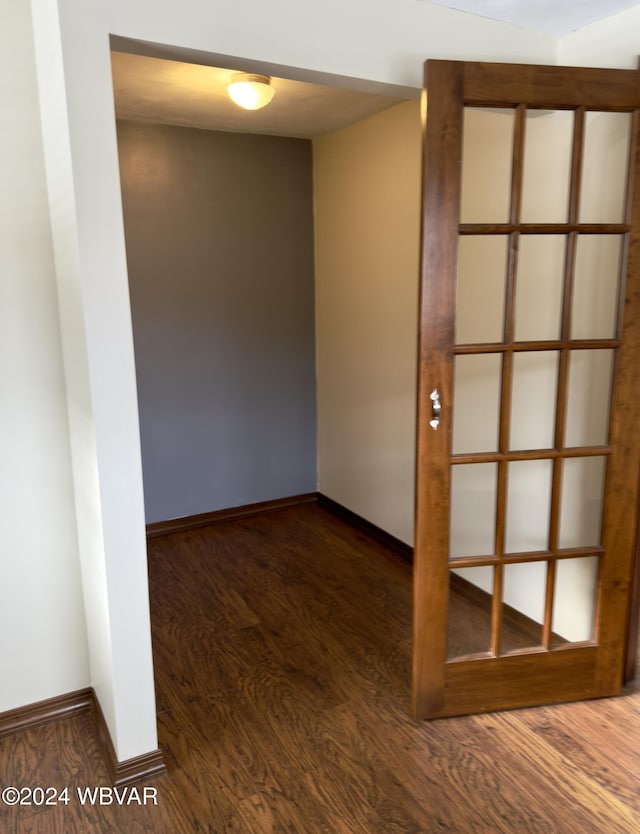 empty room featuring dark hardwood / wood-style flooring