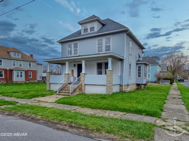 402 N Lincoln Ave, Jersey Shore, PA 17740 - american foursquare style home featuring a porch and a front lawn