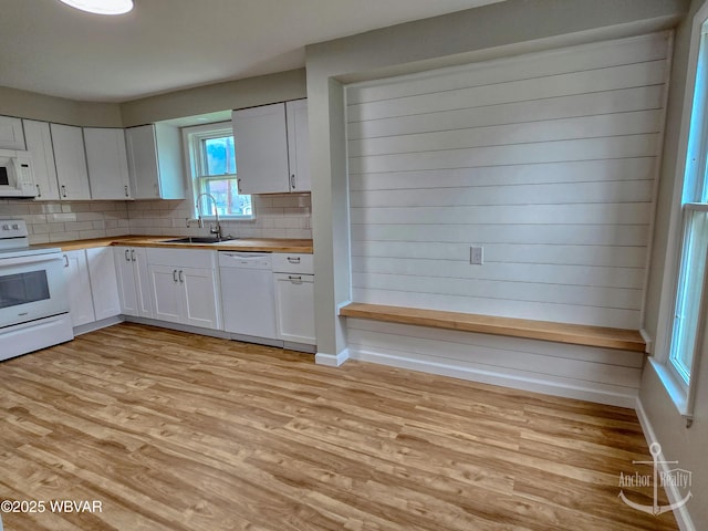 402 N Lincoln Ave, Jersey Shore, PA 17740 - kitchen featuring white appliances, a sink, light wood finished floors, and butcher block counters