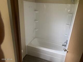 bathroom featuring washtub / shower combination