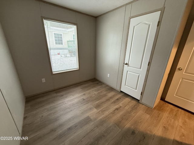 unfurnished bedroom with light hardwood / wood-style floors