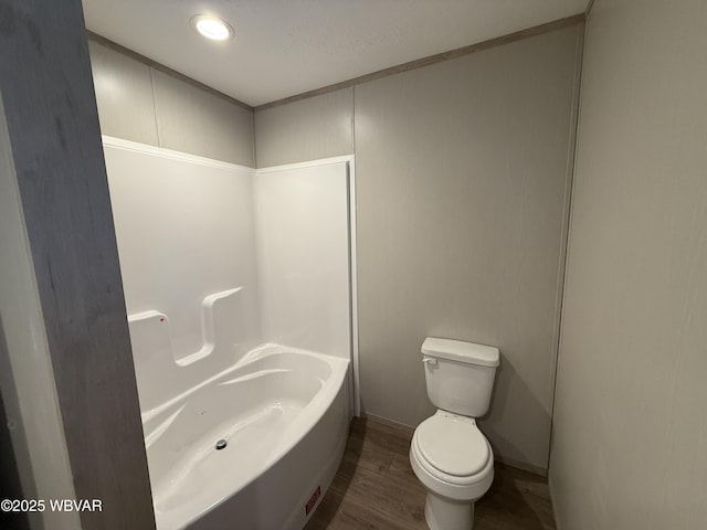 bathroom featuring hardwood / wood-style floors and toilet