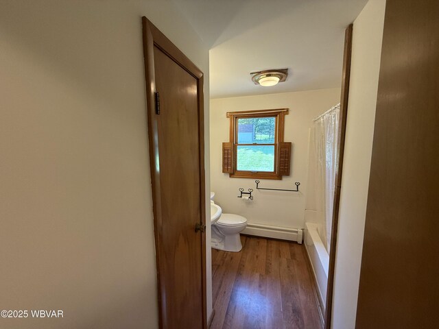 309 W Keller St, Lock Haven, PA 17745 - full bath featuring baseboard heating, wood finished floors, and shower / bath combo with shower curtain