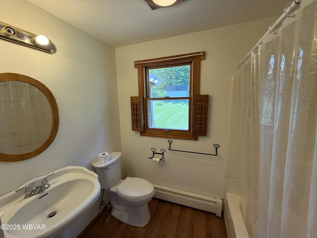 309 W Keller St, Lock Haven, PA 17745 - full bath with baseboard heating, wood finished floors, and shower / bathtub combination with curtain