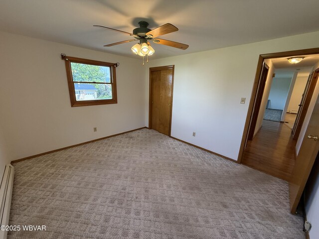 309 W Keller St, Lock Haven, PA 17745 - unfurnished bedroom with carpet flooring, a closet, ceiling fan, and a baseboard heating unit