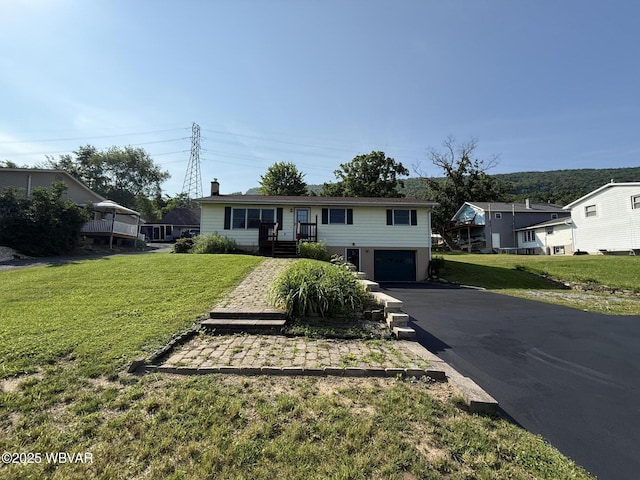 309 W Keller St, Lock Haven, PA 17745 - ranch-style home featuring a garage, asphalt driveway, and a front yard