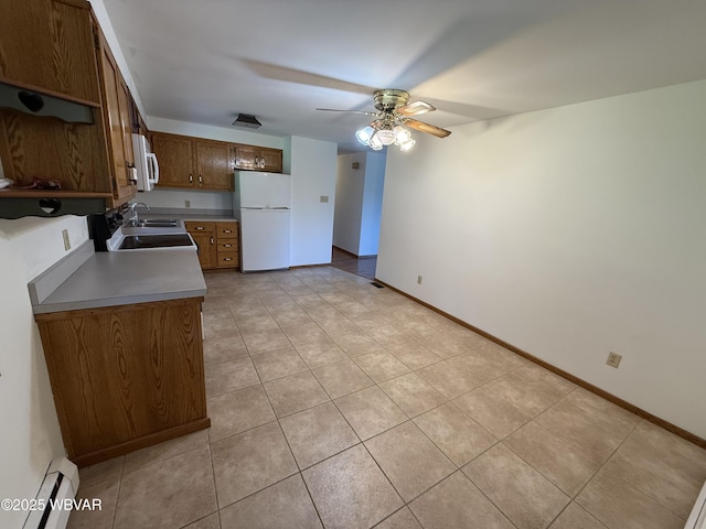 309 W Keller St, Lock Haven, PA 17745 - kitchen with white appliances, baseboard heating, ceiling fan, light tile patterned floors, and light countertops