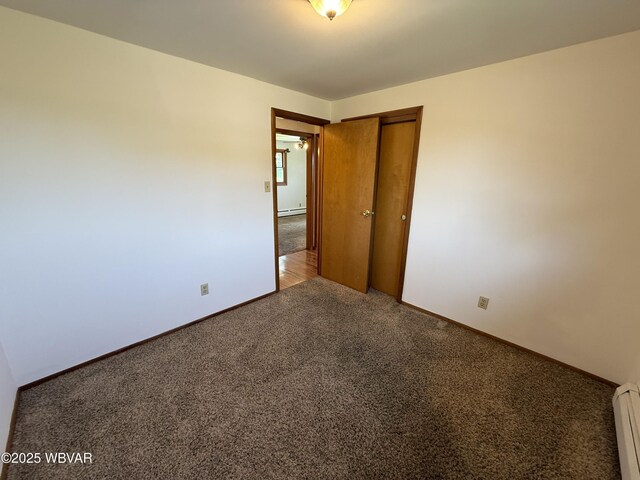 309 W Keller St, Lock Haven, PA 17745 - unfurnished room with carpet flooring and a baseboard heating unit