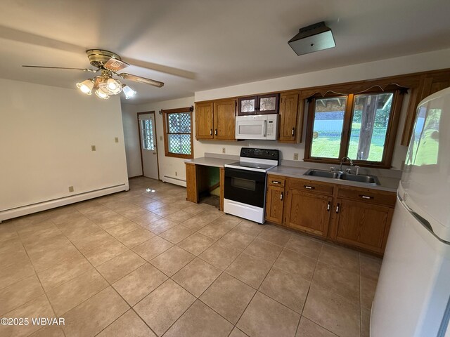 309 W Keller St, Lock Haven, PA 17745 - kitchen with white appliances, baseboard heating, light tile patterned floors, and light countertops