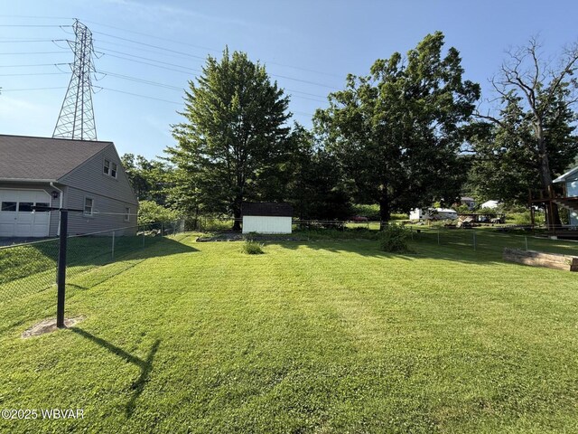 309 W Keller St, Lock Haven, PA 17745 - view of yard with a storage unit and a garage