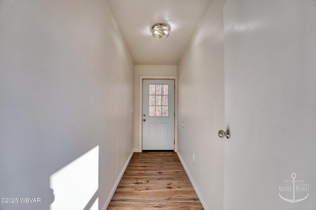 doorway to outside with light hardwood / wood-style flooring