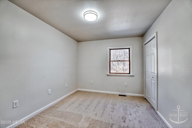 unfurnished room with carpet floors