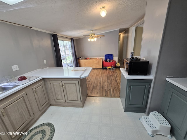 1592 Cement Hollow Rd, Jersey Shore, PA 17740 - kitchen with a textured ceiling, black microwave, light floors, ceiling fan, and gray cabinetry