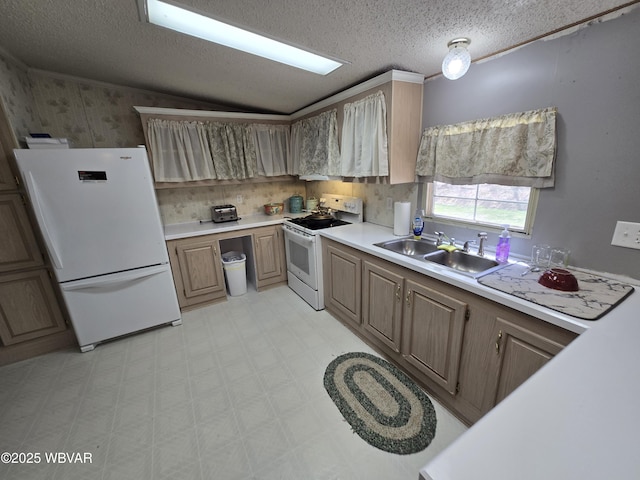 1592 Cement Hollow Rd, Jersey Shore, PA 17740 - kitchen with light floors, light countertops, a sink, white appliances, and a textured ceiling