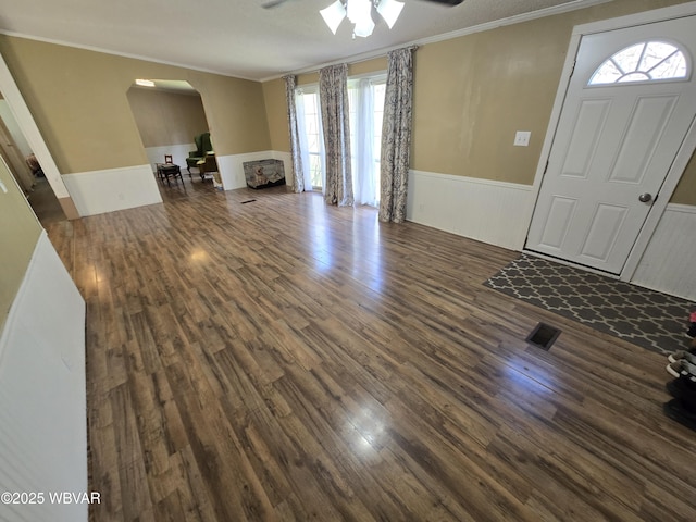 1592 Cement Hollow Rd, Jersey Shore, PA 17740 - entrance foyer with ceiling fan, arched walkways, crown molding, and a wainscoted wall