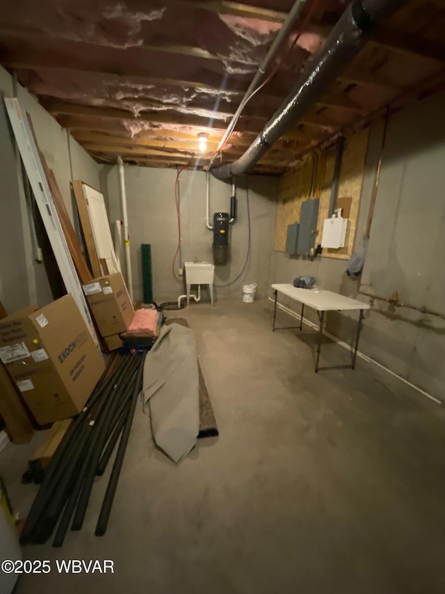 basement with sink and electric panel