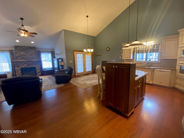 kitchen featuring high vaulted ceiling, white appliances, dark wood-type flooring, and tasteful backsplash