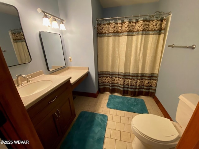 bathroom featuring a shower with curtain, tile patterned floors, vanity, and toilet