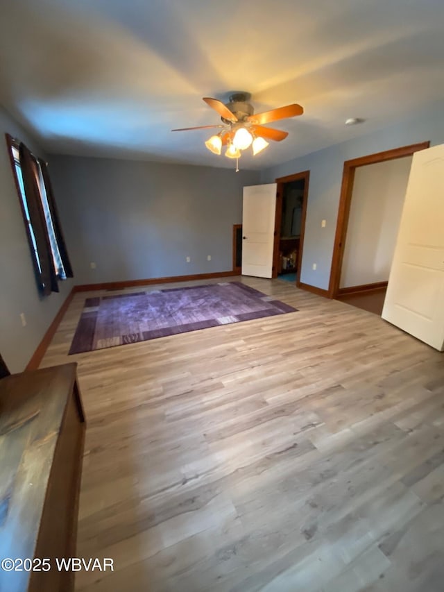 unfurnished room with ceiling fan and light hardwood / wood-style flooring