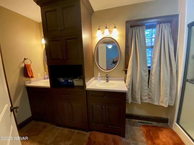 bathroom featuring tile patterned flooring and vanity