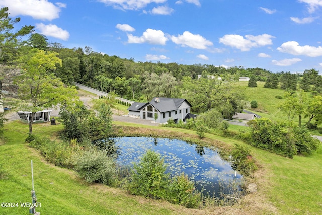 bird's eye view featuring a water view and a wooded view