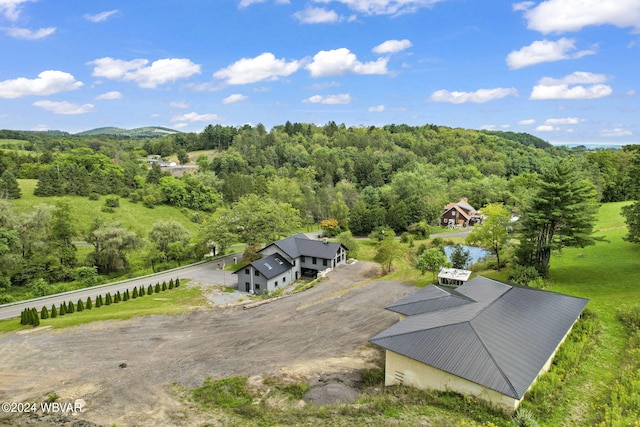 aerial view featuring a view of trees