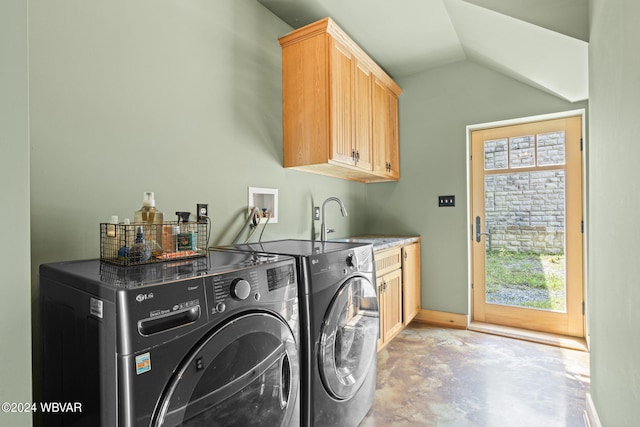 laundry room featuring cabinet space, independent washer and dryer, and a sink