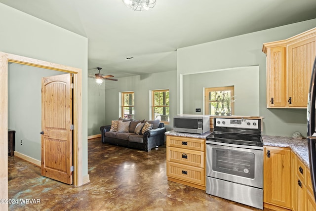 kitchen with baseboards, ceiling fan, appliances with stainless steel finishes, light brown cabinetry, and concrete floors