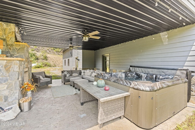 view of patio / terrace featuring an outdoor hangout area, a ceiling fan, and a hot tub