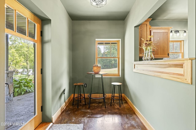 interior space featuring baseboards