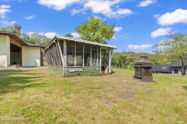 view of yard with a sunroom