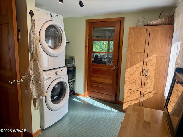 61 W Houston Ave, Montgomery, PA 17752 - laundry room with stacked washer / dryer and tile patterned flooring