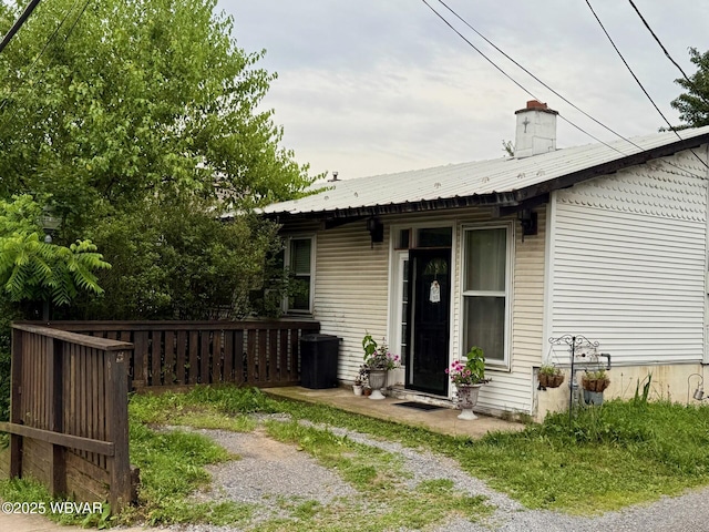 61 W Houston Ave, Montgomery, PA 17752 - back of house featuring a metal roof and a chimney