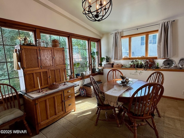 61 W Houston Ave, Montgomery, PA 17752 - dining room with lofted ceiling, a chandelier, and healthy amount of natural light